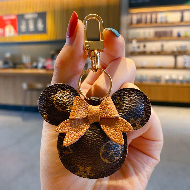 Llavero de lujo de Mickey – Cuero sintético & Colgante con pompón de piel para bolso o automóvil